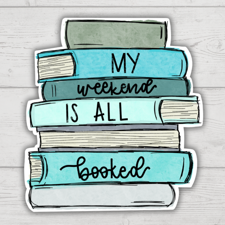 A sticker with a book design, featuring the text 'MY WEEKEND IS ALL BOOKED' on a wooden background.